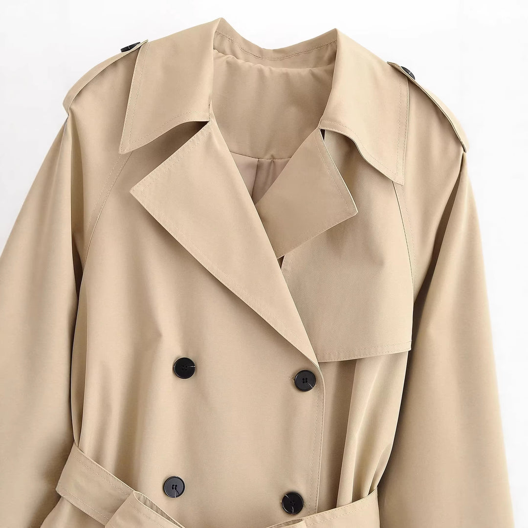 Women's short trench coat with wide cut, double-breasted button placket and waist belt Mune Fashion