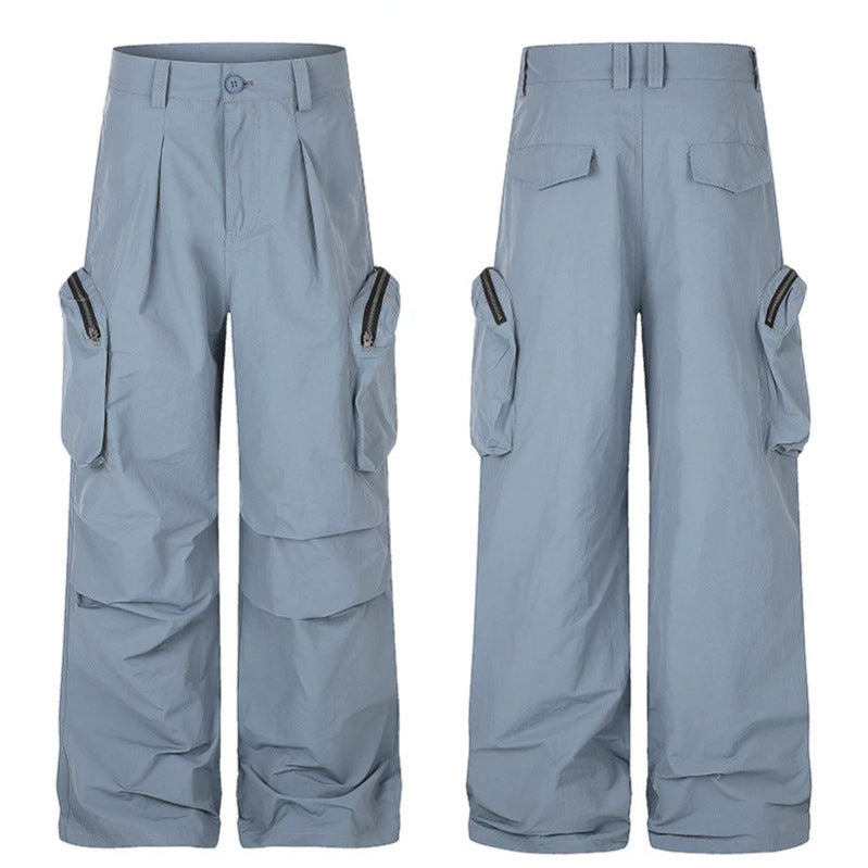 Women wide-cut cargo palazzo pants with high waist, zip pockets and layered panels Mune Fashion