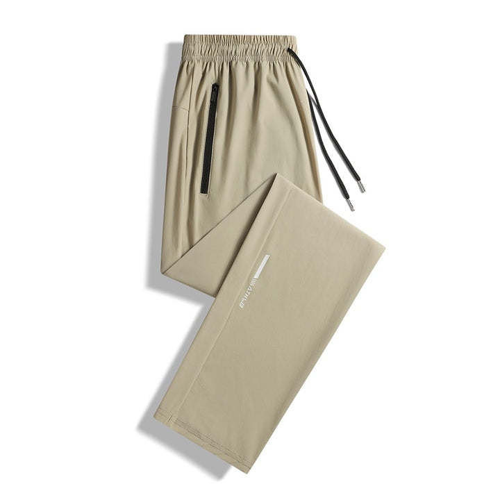 Men's sporty jogging pants with elastic waistband and practical zip pockets Mune Fashion