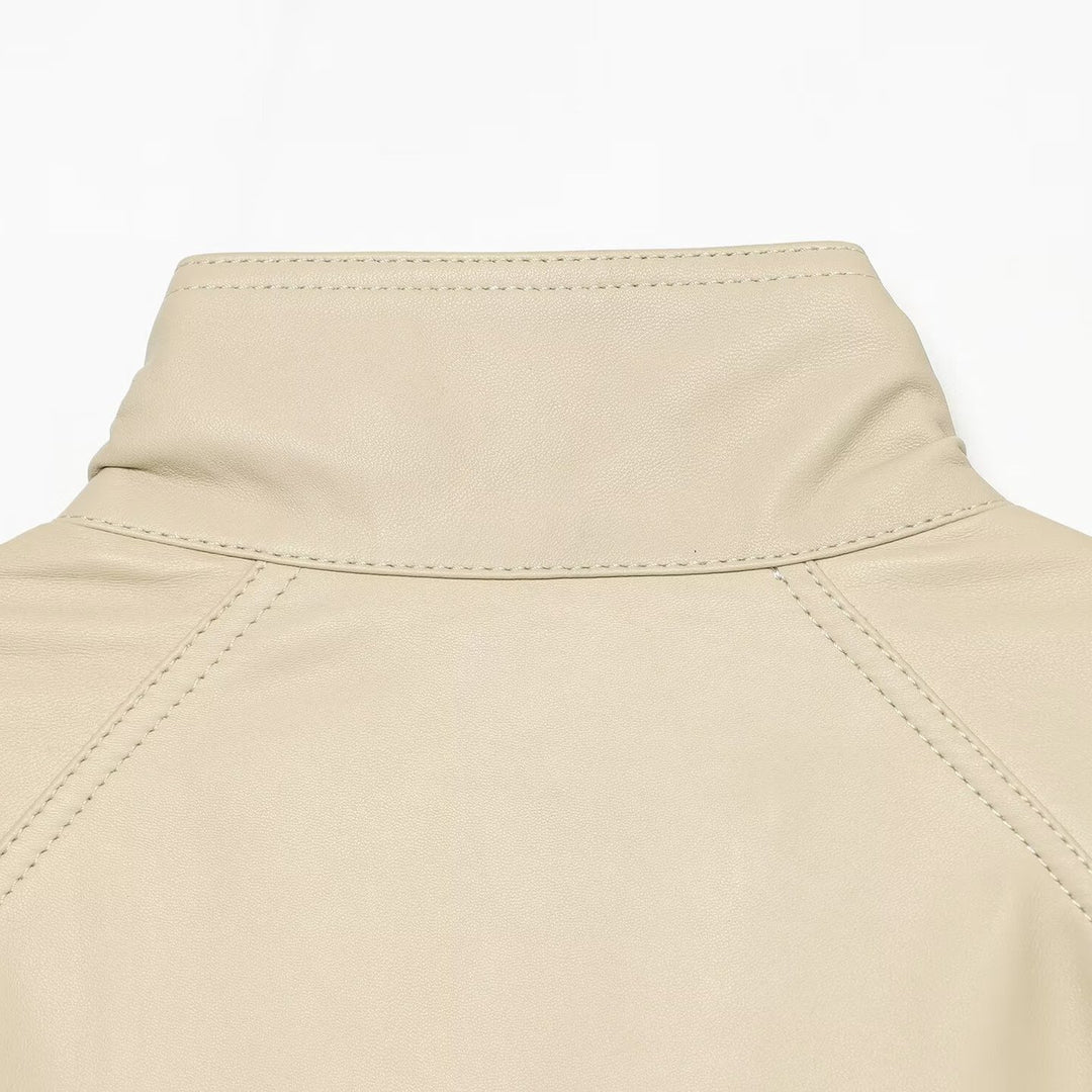Women's loosely cut leather-look transitional jacket with stand-up collar, two-way zipper, and kangaroo pockets Mune Fashion