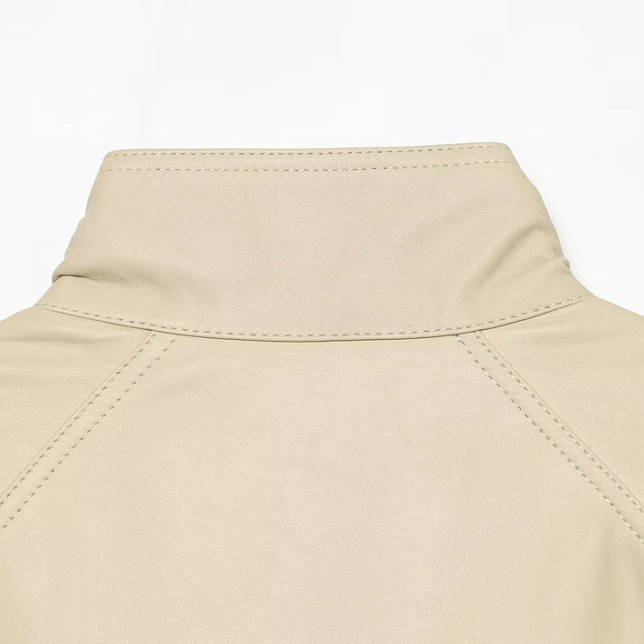 Women's loosely cut leather-look transitional jacket with stand-up collar, two-way zipper, and kangaroo pockets Mune Fashion