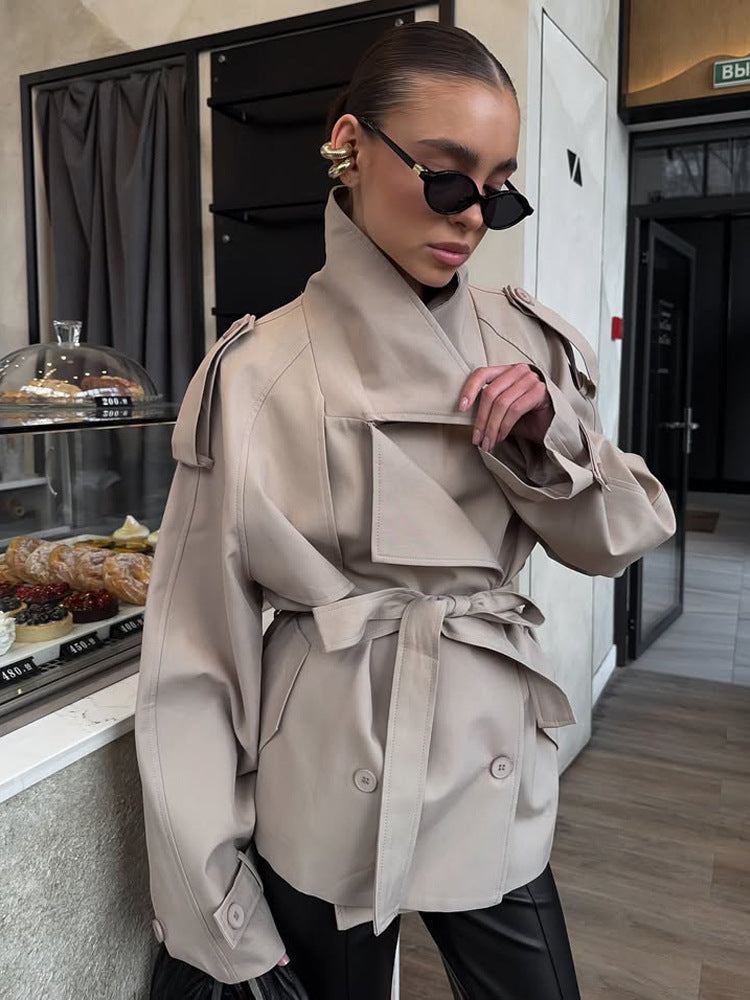 Women's short trench coat with wide standing collar, shoulder epaulettes, and waist belt Mune Fashion