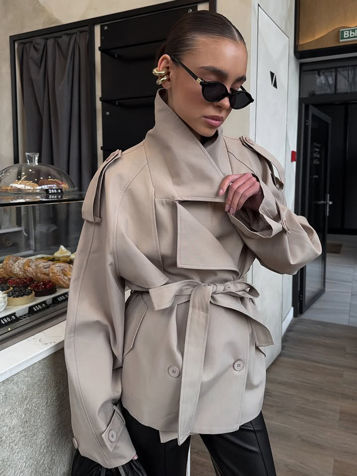 Women's short trench coat with wide standing collar, shoulder epaulettes, and waist belt Mune Fashion