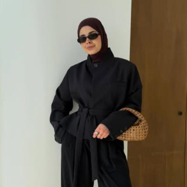 Women's tailored short blazer with standing collar, peplum, and tie belt Mune Fashion