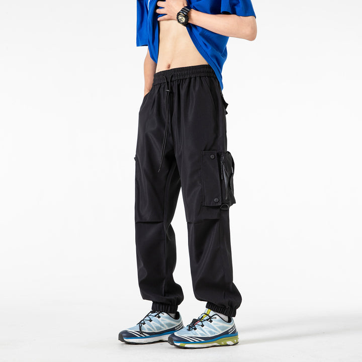 Men's Wide Technical Cargo Jogger with elastic drawstring waistband, multifunctional cargo pockets and adjustable leg openings Drune