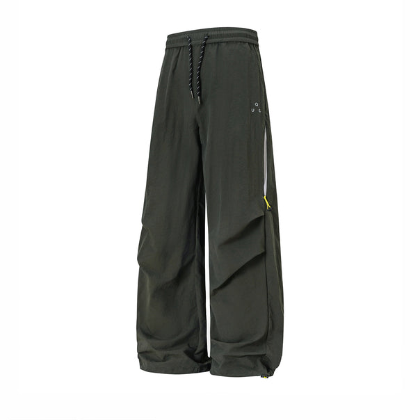 Unisex wide technical cargo pants with drawstring waistband, zip pockets, and adjustable hem Mune Fashion