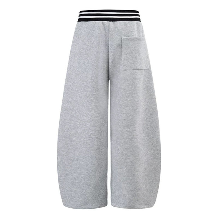 ladies culotte jogging pants with high-contrast waistband, patch pockets, and drawstring hem.