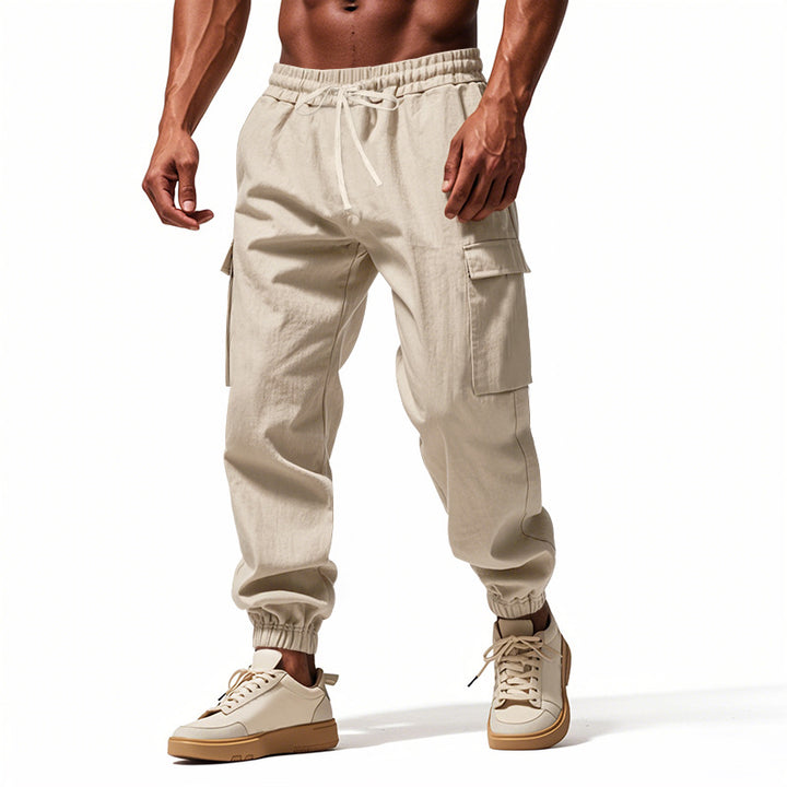 Men's tapered joggers in utilitarian style with elastic waistband, drawstring, and flap pockets Mune Fashion