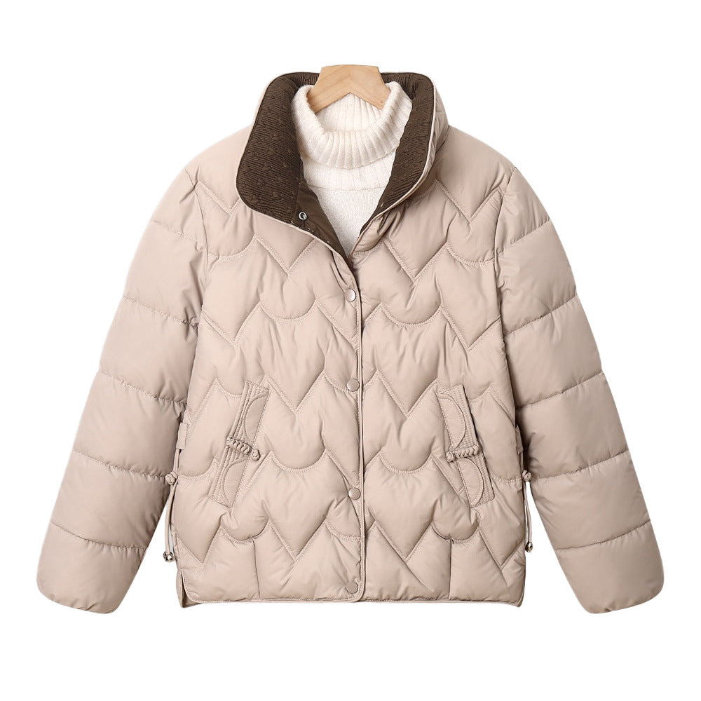Women's short quilted puffer jacket with decorative curved quilting and snap button placket Mune Fashion