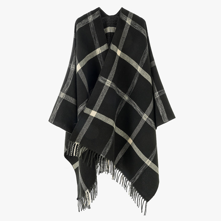 Women's large checkered wool look poncho in cape cut with loose drape and fringes.