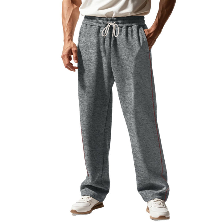 Men's casually fitting sweatpants with side decorative seam, elastic comfort waistband, and deep side pockets Mune Fashion