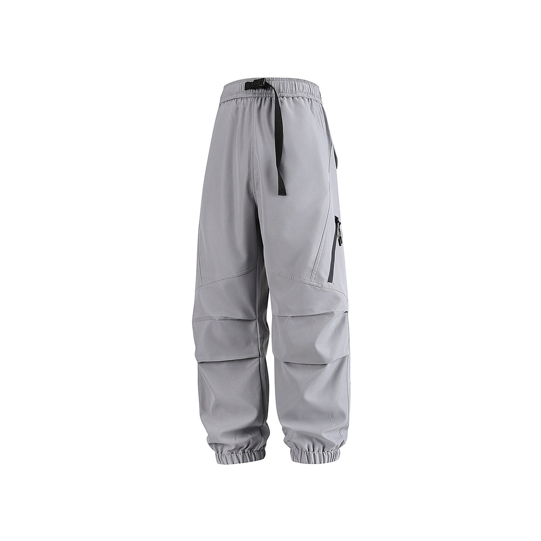 Men's loose technical cargo jogger pants with elastic drawstring waistband, patch flap pockets, and zippered leg pocket Drune