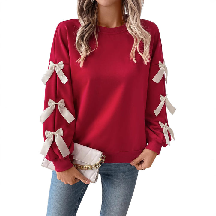 Women's sweatshirt with decorative bows on the sleeves Mune Fashion