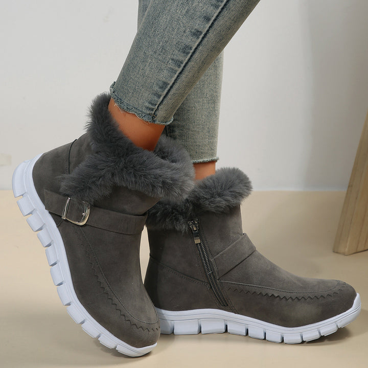 Women's non-fleece short boots with faux fur trim, suede leather look, side zipper, decorative metal buckle, and profiled lightweight sole Mune Fashion