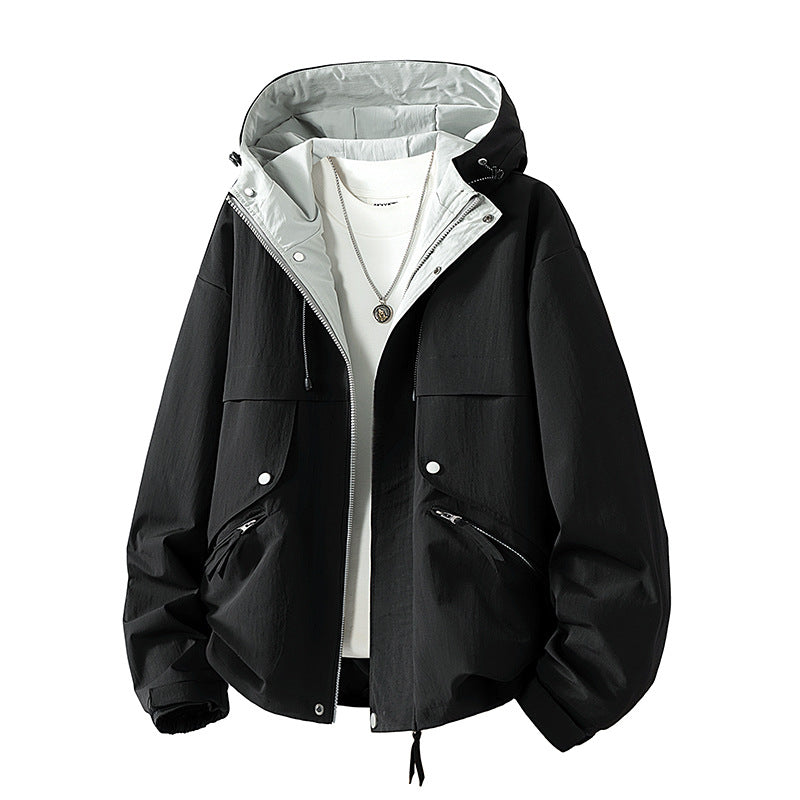 Unisex lightweight windproof transitional jacket with adjustable hood, drawstring, and zippered pockets Mune Fashion
