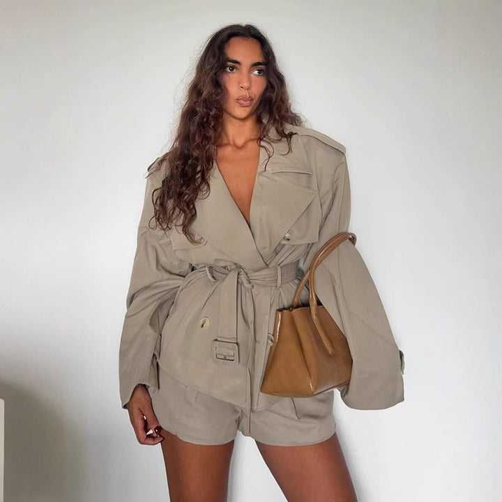 Women's short trench-style jacket with a tailored tie belt and wide sleeves Mune Fashion
