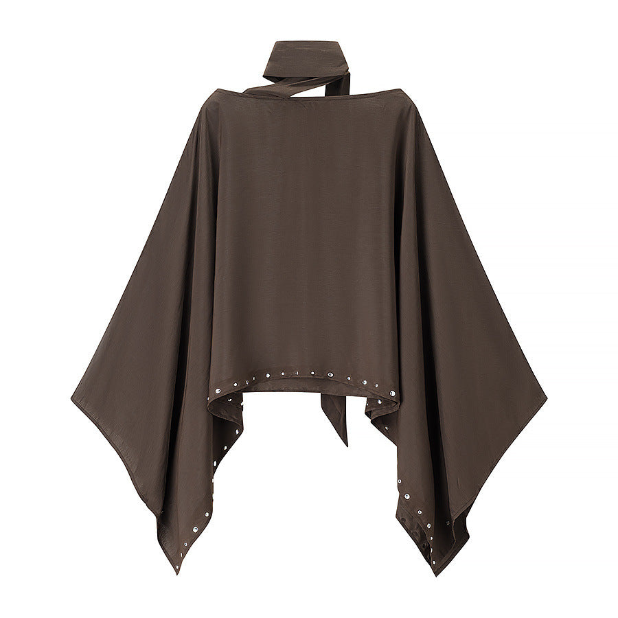 Women’s flowing cape poncho with bow, asymmetrical pointed hem and eyelet trim Mune Fashion