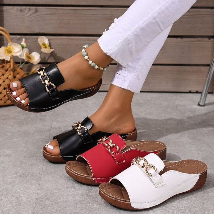 Women's open slide with square toe area, padded comfort footbed and decorative metal chain Mune Fashion