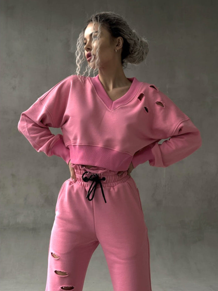Ladies short-cut sweat set with V-neck, ruffled waistband high-waist joggers and distressed details Mune Fashion