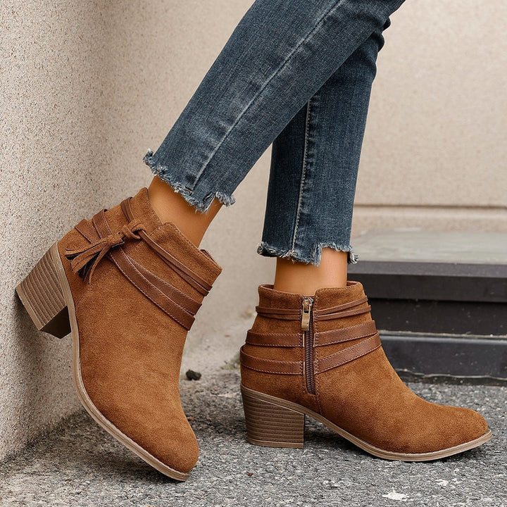 Ladies faux suede ankle boots with decorative straps, tassels, and side zipper Mune Fashion
