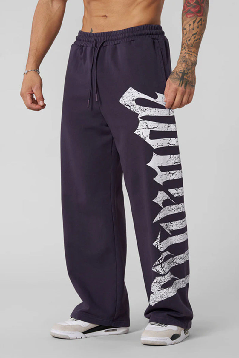 Men's wide sweatpants made of brushed fleece with side vintage print and drawstring waistband Mune Fashion