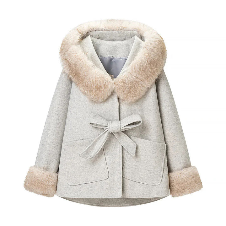 Women's hooded coat in cape cut with faux fur collar, tie belt, and patch pockets Mune Fashion