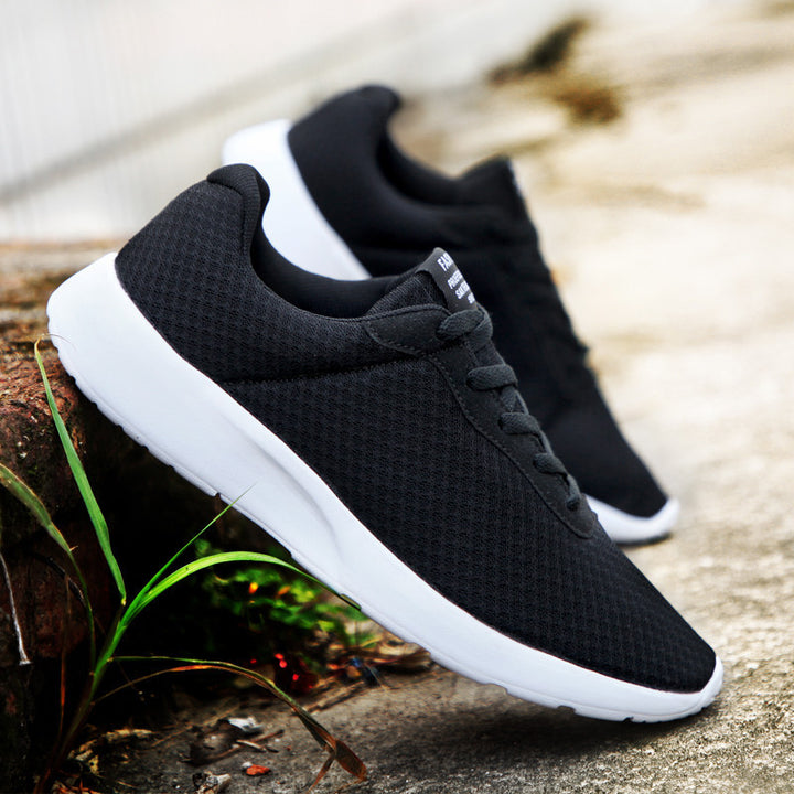 Unisex lightweight training sneakers with seamless knitted upper material, padded heel collar, and responsive EVA midsole Mune Fashion