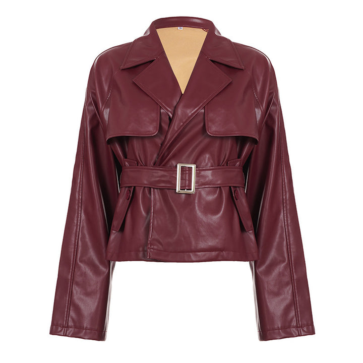 Women's short faux leather trench coat with waist belt, wide lapel and cape detail Mune Fashion