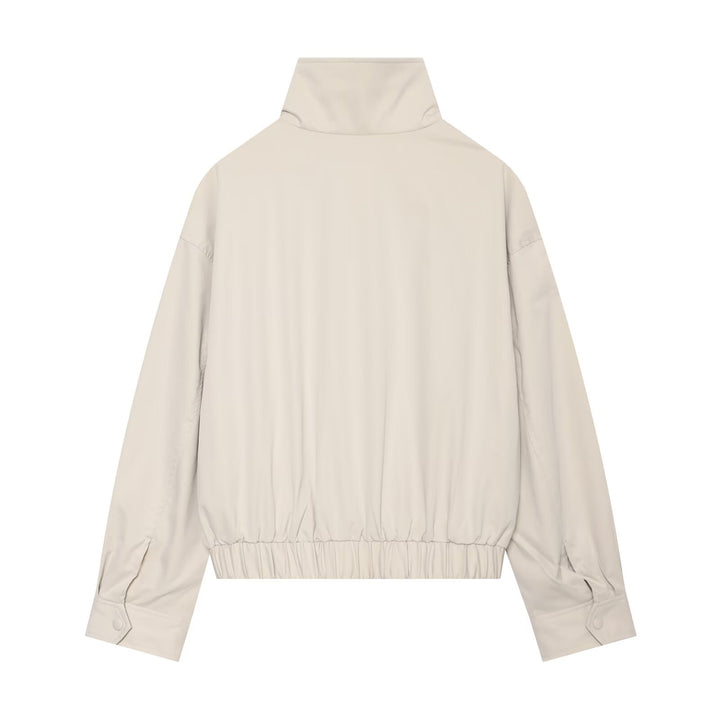 Ladies short cut trench-inspired jacket with high stand-up collar and waist belt Mune Fashion