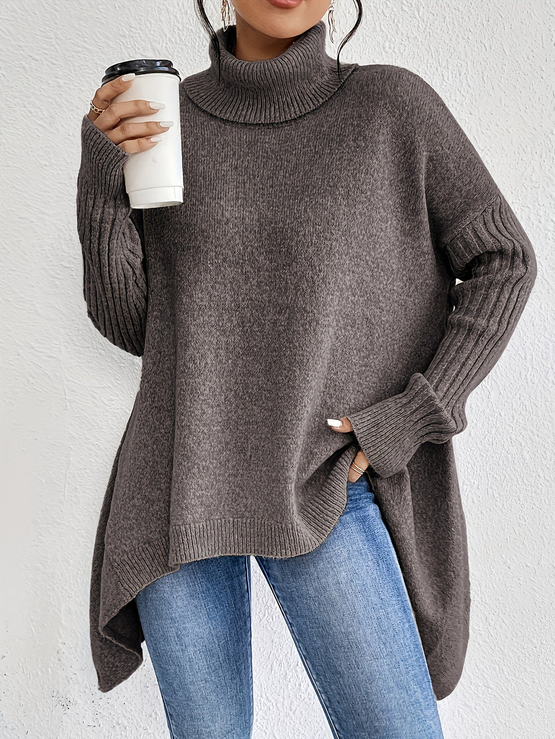 Women's oversized knit sweater with high turtleneck, ribbed sleeves, and asymmetric hem Mune Fashion