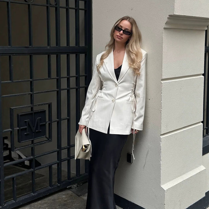 Women's tailored blazer with deep V-neck, zipper front and drawstring detail Mune Fashion