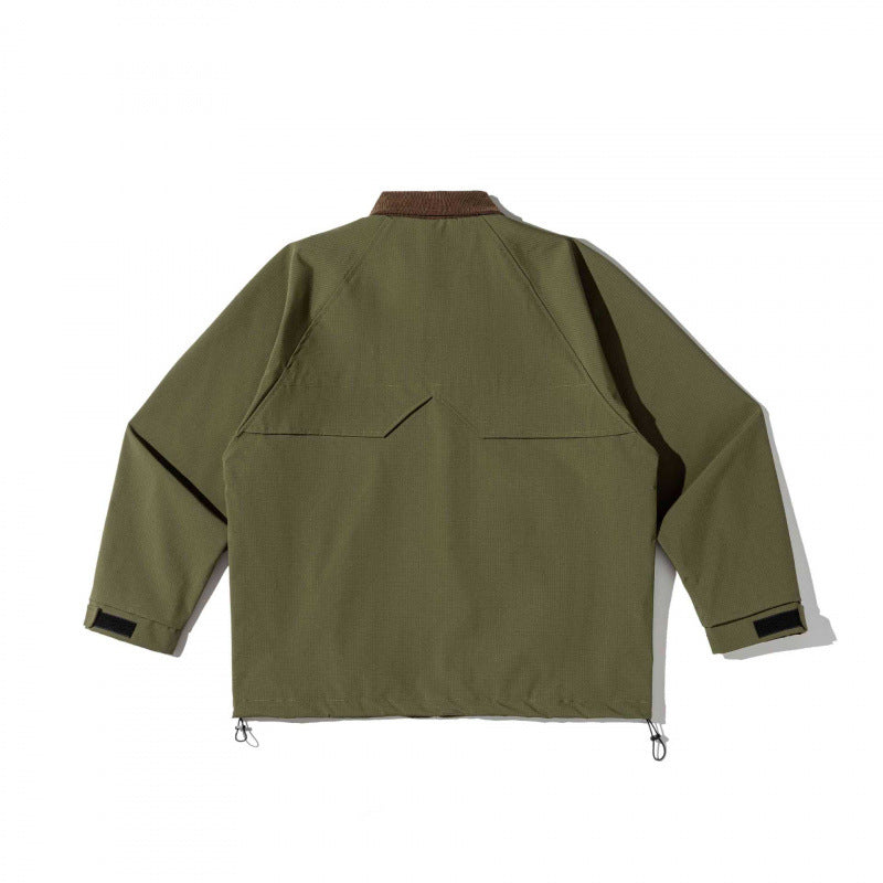 Unisex boxy overshirt jacket in utility style with cord collar, flap pockets and drawstring hem Mune Fashion