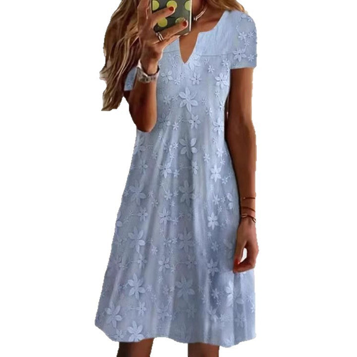 Women's knee-length A-line dress made of cotton blend with embroidered broderie overlay, short sleeves and V-neck Mune Fashion