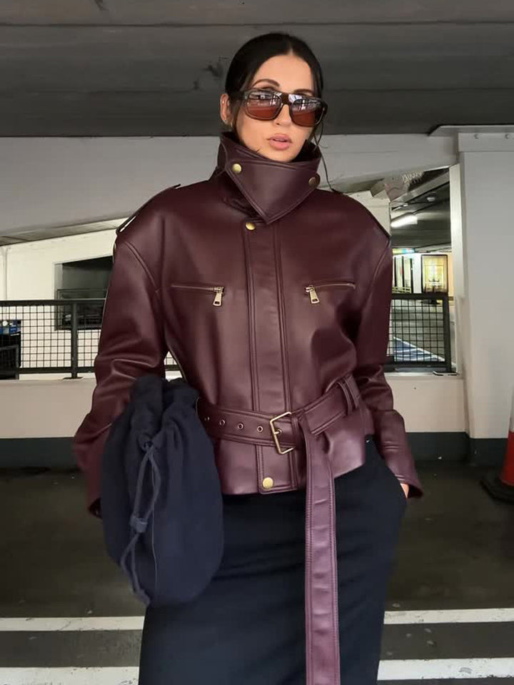 Women's fitted faux leather bomber jacket with high stand collar and tie belt Mune Fashion
