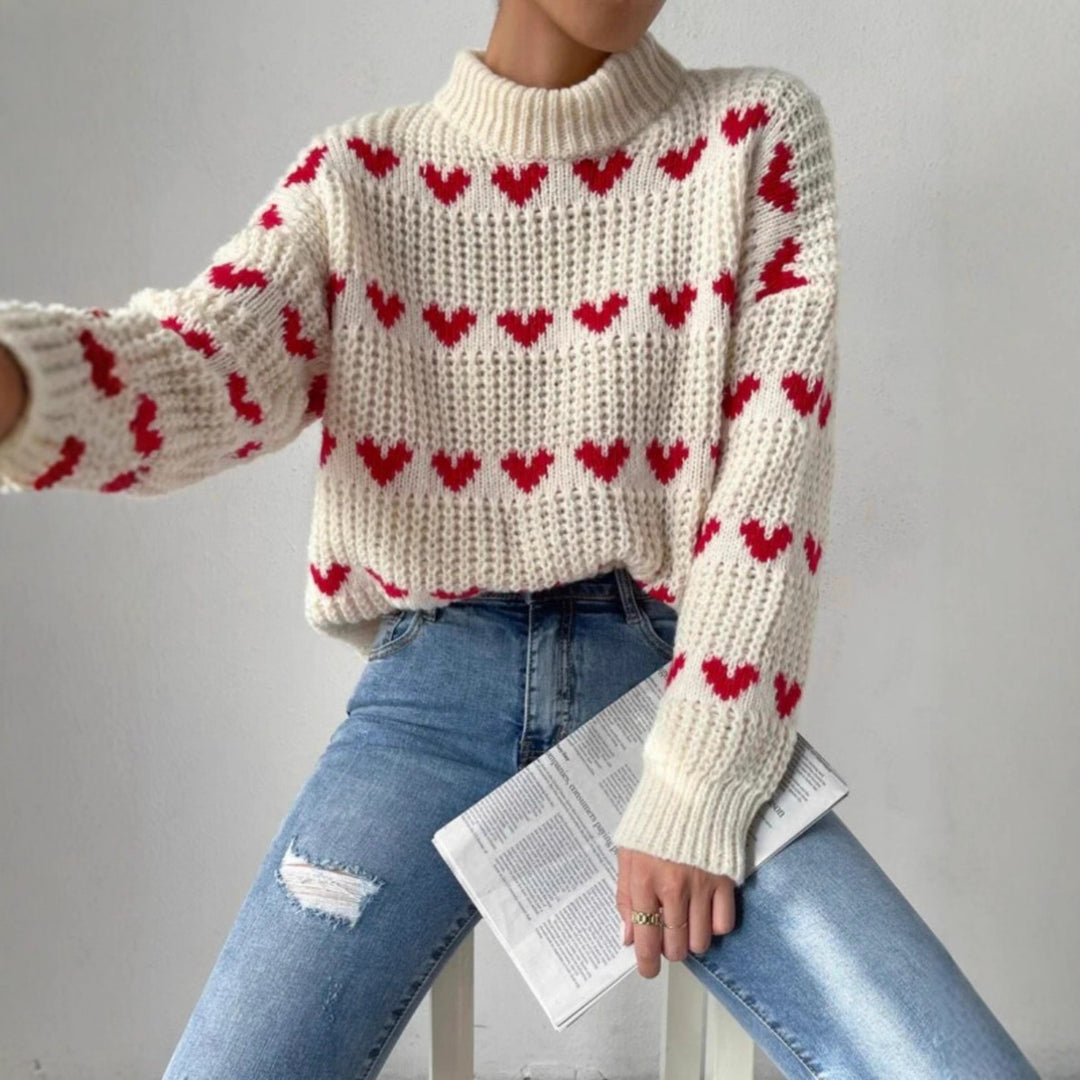 Women's chunky knit sweater with knitted heart patterns, high stand-up collar, and relaxed oversized silhouette Mune Fashion