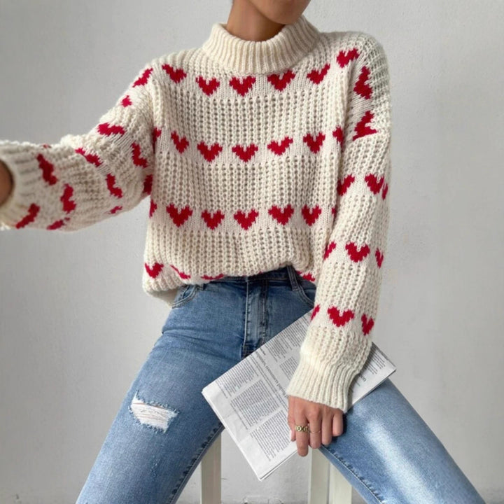 Women's chunky knit sweater with knitted heart patterns, high stand-up collar, and relaxed oversized silhouette Mune Fashion