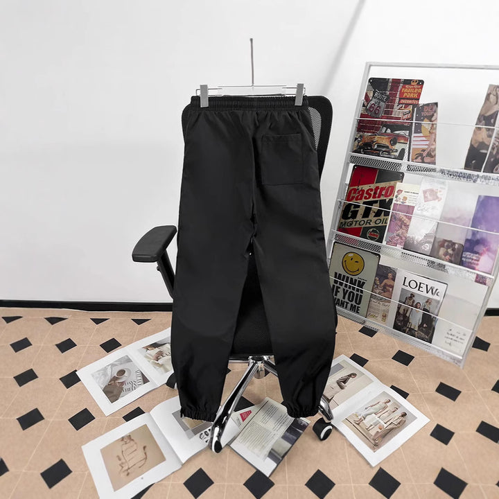 Unisex sporty jogging pants with adjustable waistband and side pockets Mune Fashion