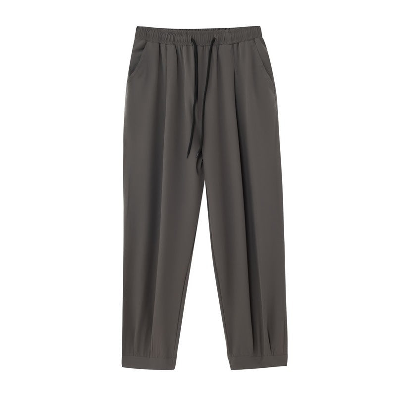 Men's wide technical jogging pants with elastic waistband, gathered leg cuffs, and breathable stretch material Mune Fashion
