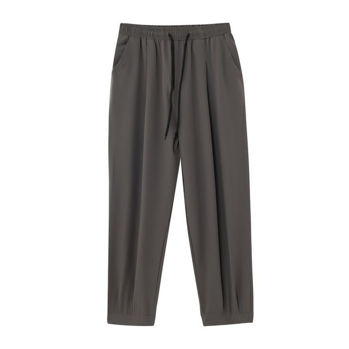 Men's wide technical jogging pants with elastic waistband, gathered leg cuffs, and breathable stretch material Mune Fashion