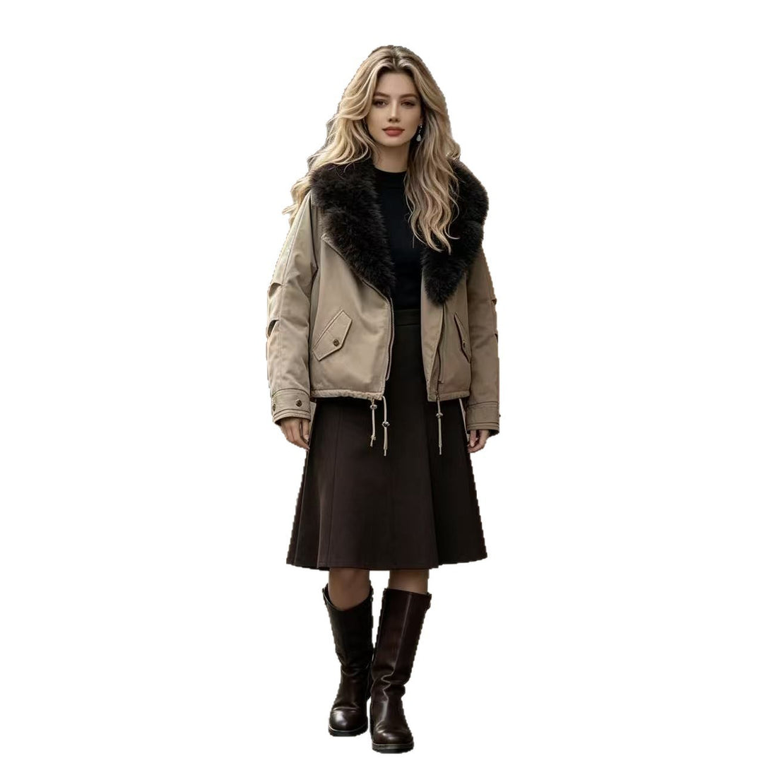 Women's short bomber jacket with voluminous faux fur collar, drawstring hem, and flap pockets Mune Fashion