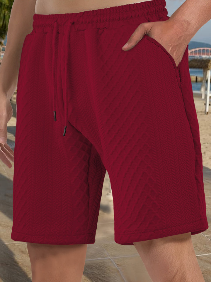 Men's textured beach bermuda shorts made of waffle jersey with elastic drawstring waistband and slanted pockets Mune Fashion