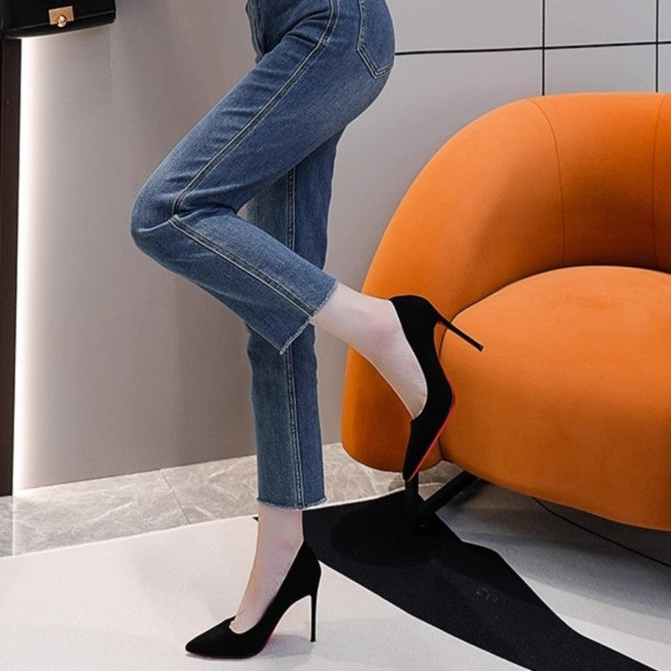 Ladies elegant pointed suede pumps with contrasting red sole and narrow stiletto heel