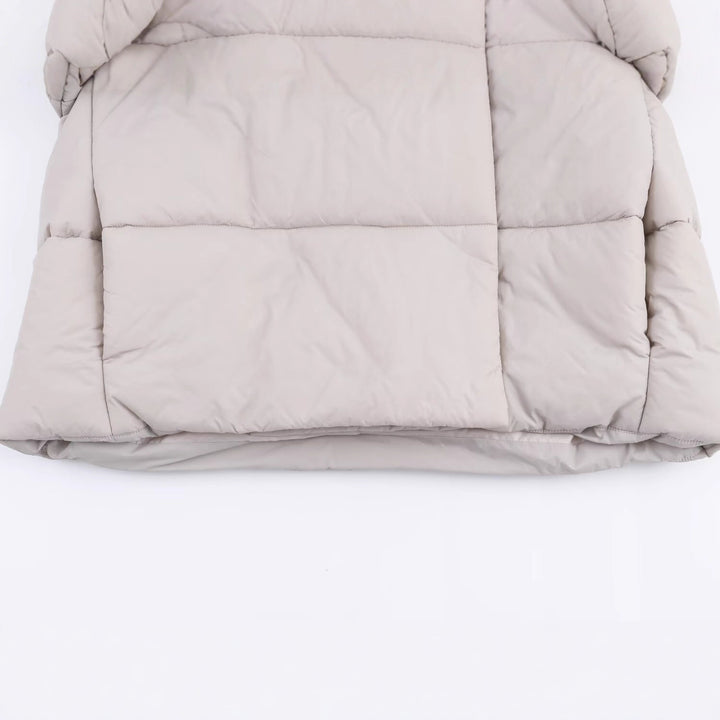 Women short cut oversized quilted jacket with high wrap collar and padded lining Mune Fashion