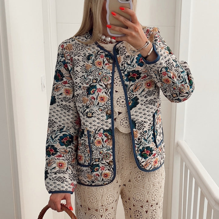 Ladies' quilted blouse jacket with floral-ethnic print, light padding and contrasting piping Mune Fashion