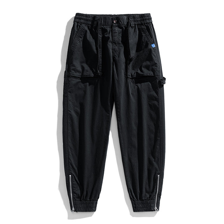 Men's workwear cargo pants in tech jogger style with applied front pockets, hammer loop, and ankle zippers Drune