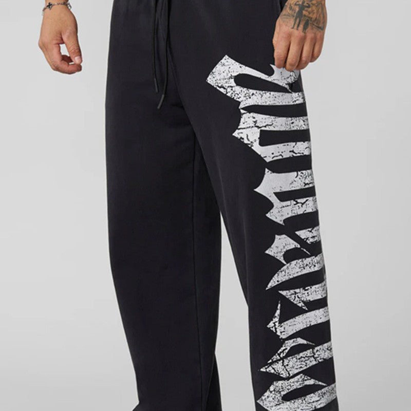 Men's wide sweatpants made of brushed fleece with side vintage print and drawstring waistband Mune Fashion