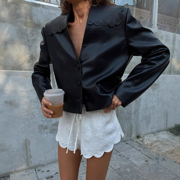 Women’s short jacket made of faux leather with floral laser-perforated collar and boxy cropped cut Mune Fashion