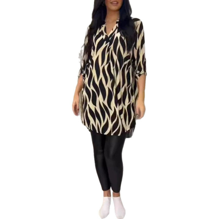 Women's oversized tunic blouse with organic leaf print, V-neckline, half button placket, and rounded hem Mune Fashion