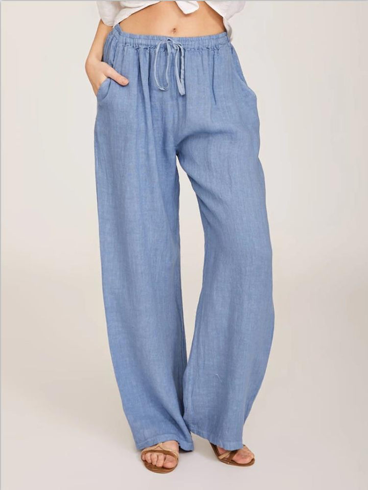 Women's airy palazzo pants with drawstring waistband, elastic waist finish, and side pockets Mune Fashion