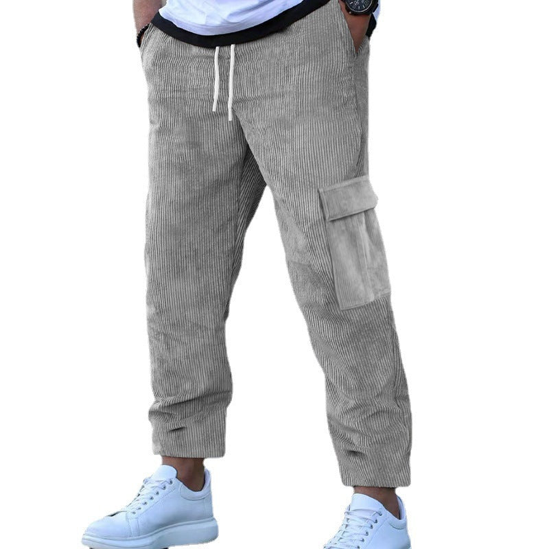 Men's corduroy jogger-style pants with elastic drawstring waistband, flap cargo pockets, and tapered leg Mune Fashion